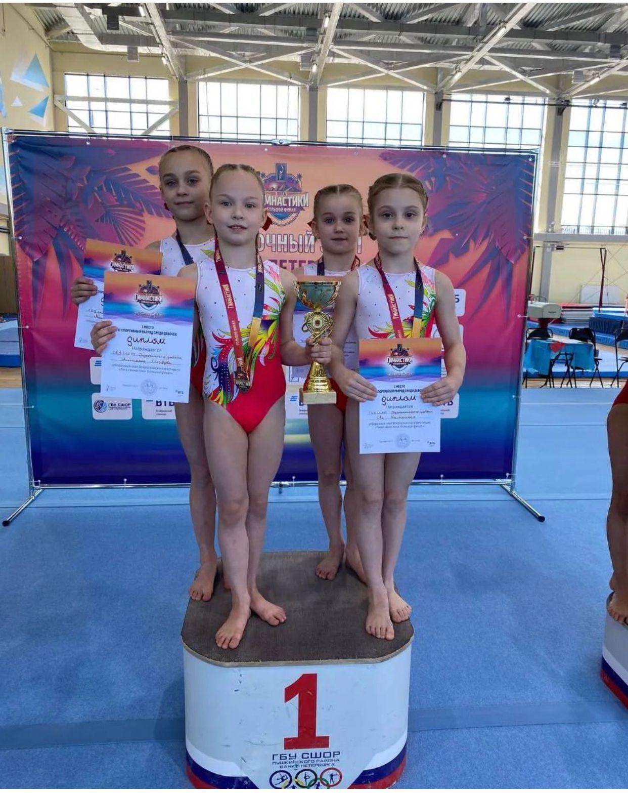Купальник женский для спортивной гимнастики GK Sport GYM RU 107-62 белый с оранжевым со стразами без рукава
